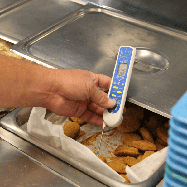 food thermometer being used during restaurant inspection