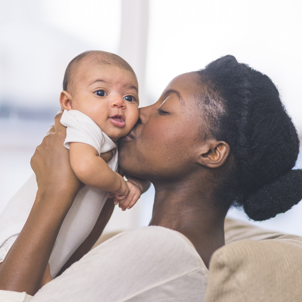 African American Mother Kissing Infant
