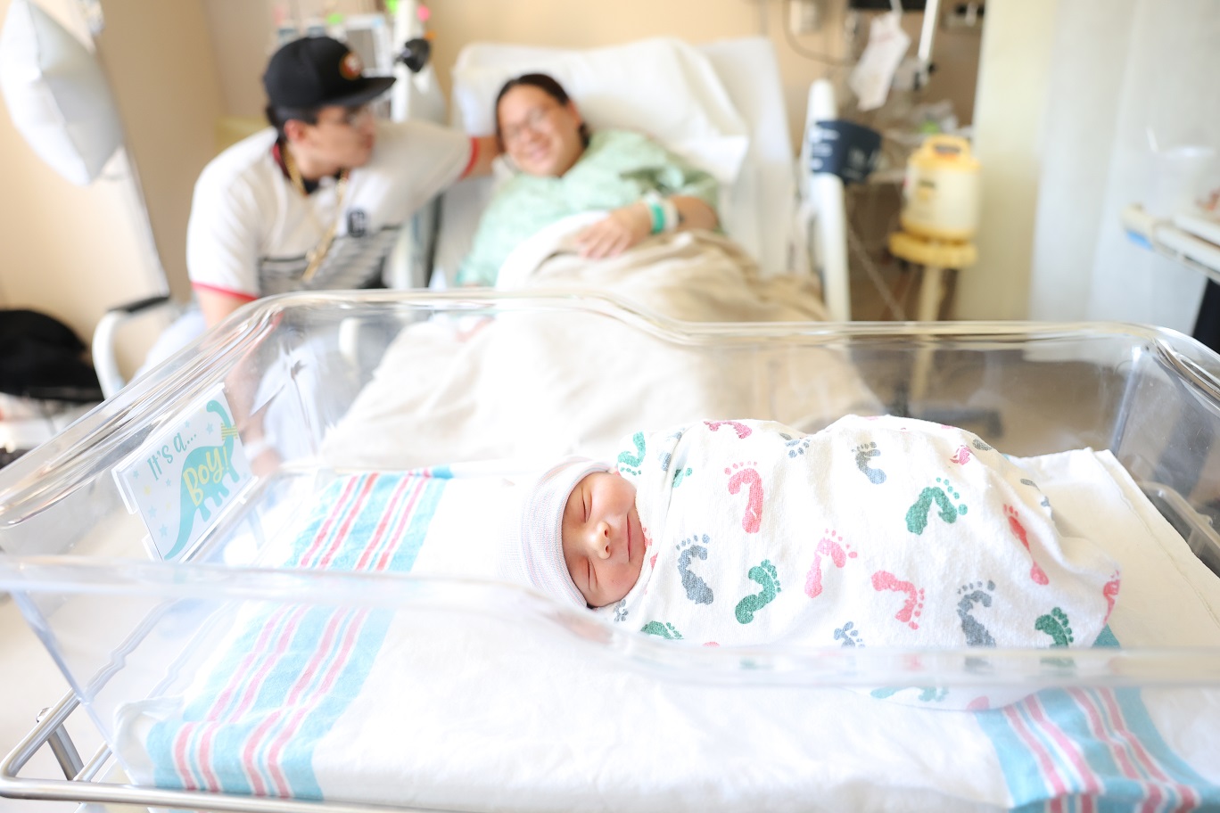Newborn baby in swaddle at hospital